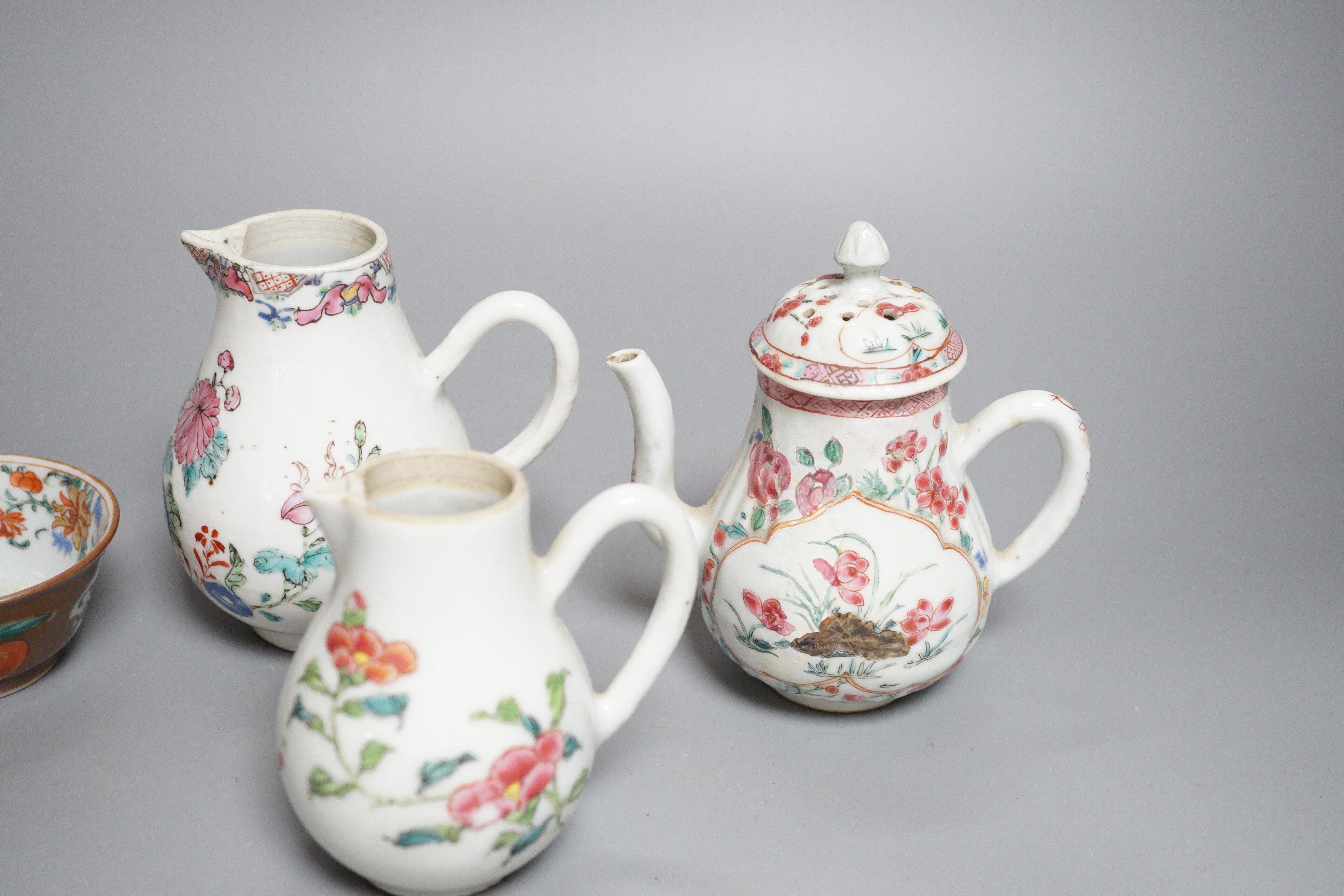 Three Chinese export famille rose cream jugs, one with pierced cover and three small bowls, 18th century and later